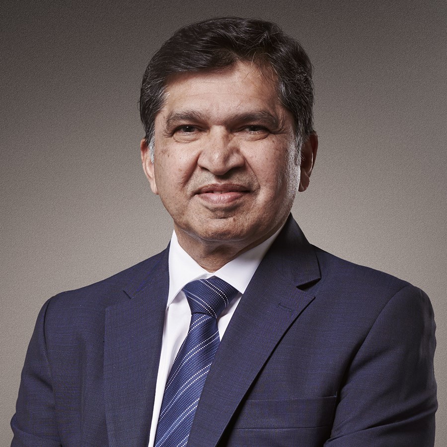 A person in a suit and tieDescription automatically generated